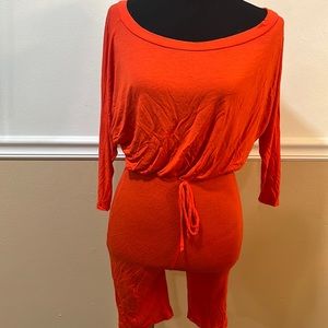 Fashion love orange one piece jumper. Size small spandex material
